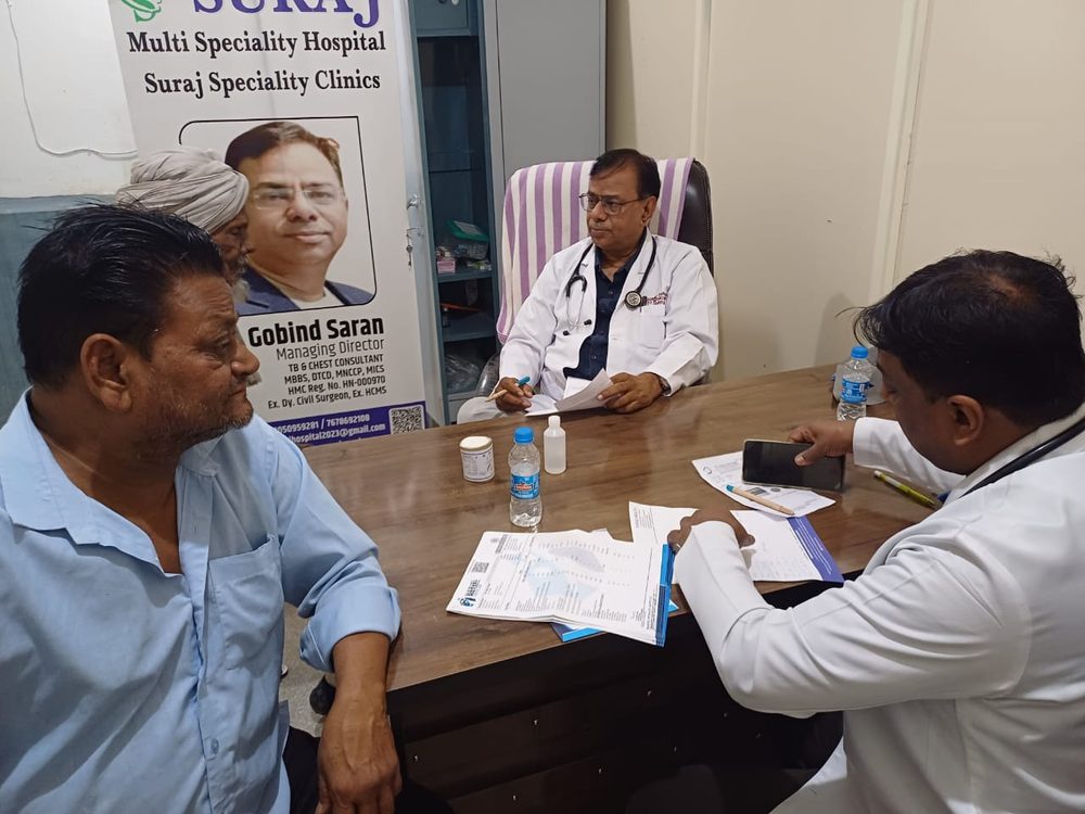 Free health check-up camp with doctors examining a patient