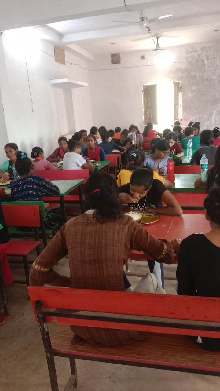 Women trainees sharing a meal at the training centre